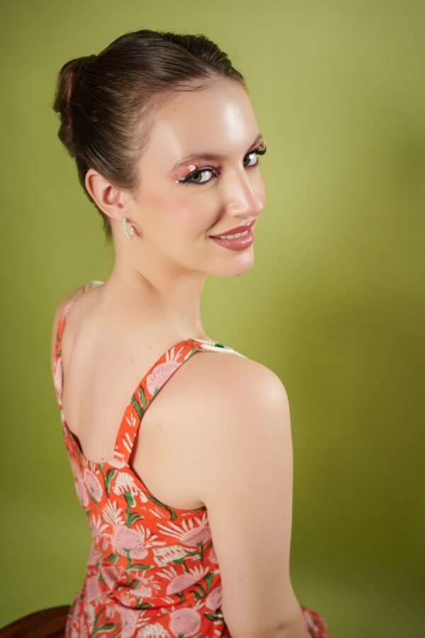 model smiling in peachy set