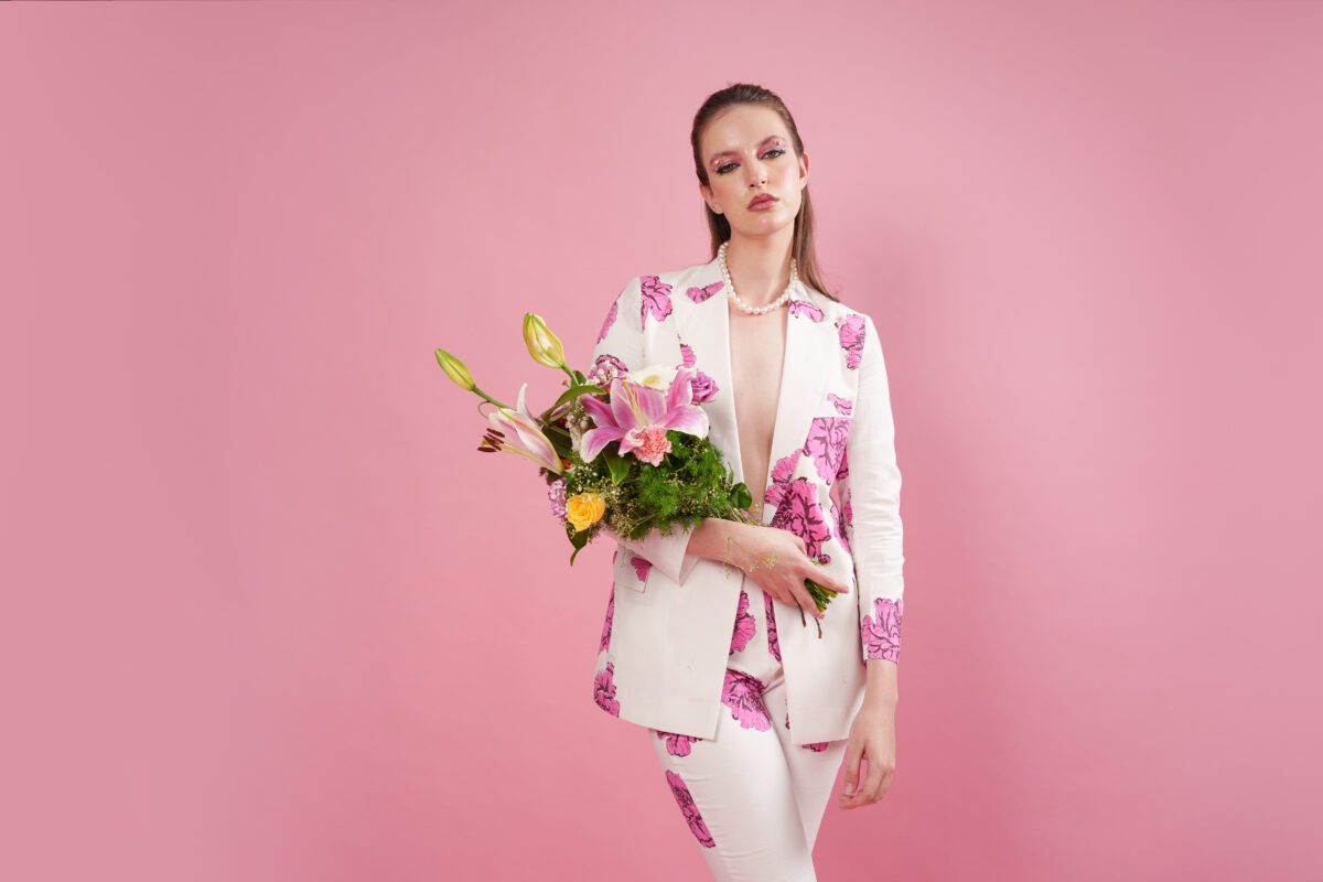 blush set model holding flowers blazer