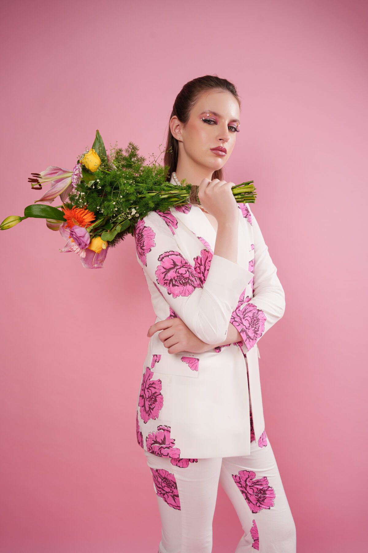 blush set blazer model holding flowers leftside