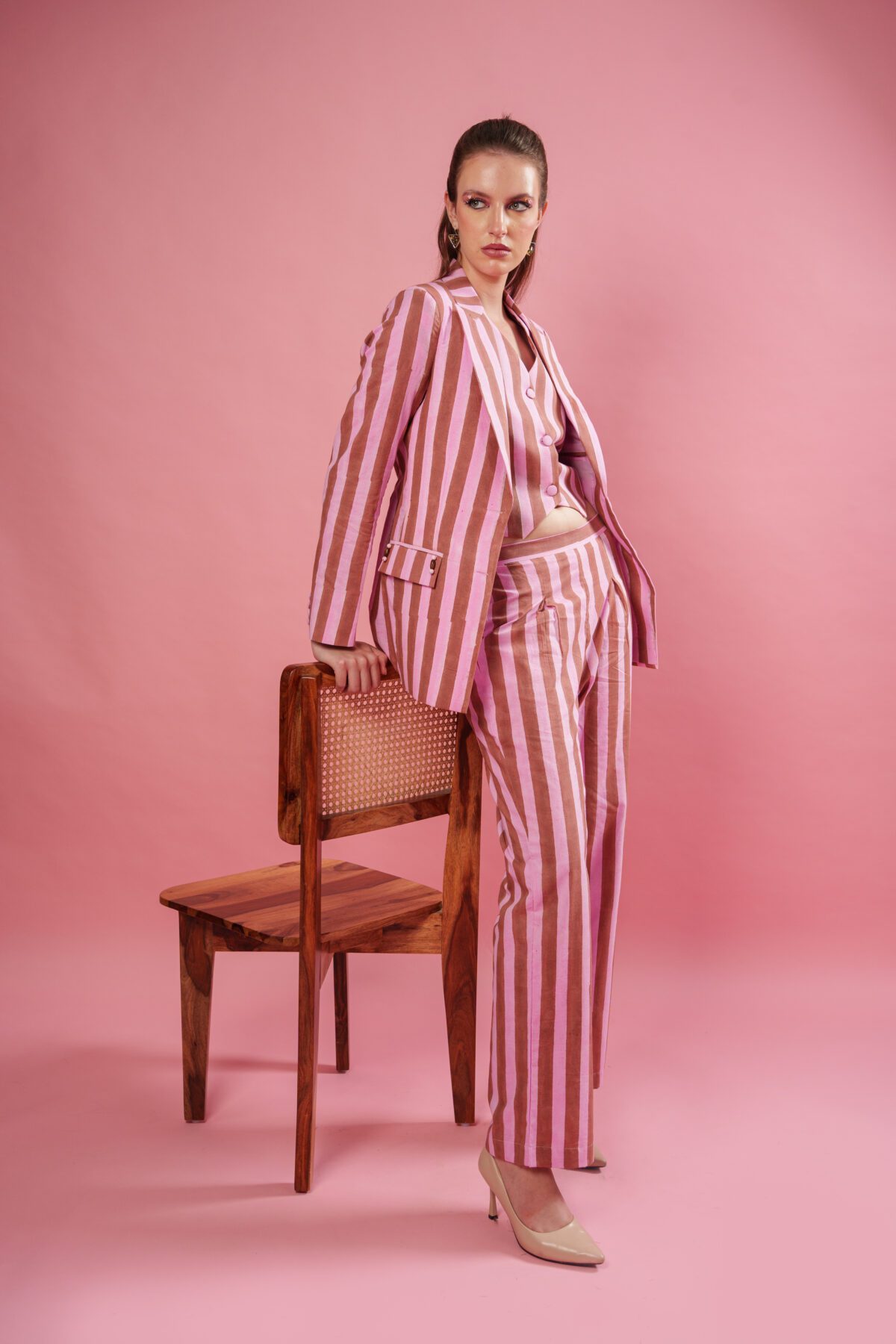 Rosewood set model leaning on chair
