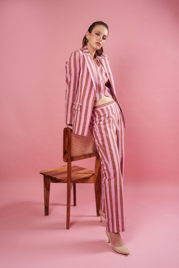 Rosewood set model leaning on chair and looking down