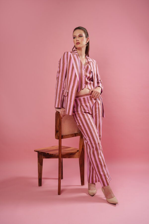 Rosewood set model leaning on chair and looking left
