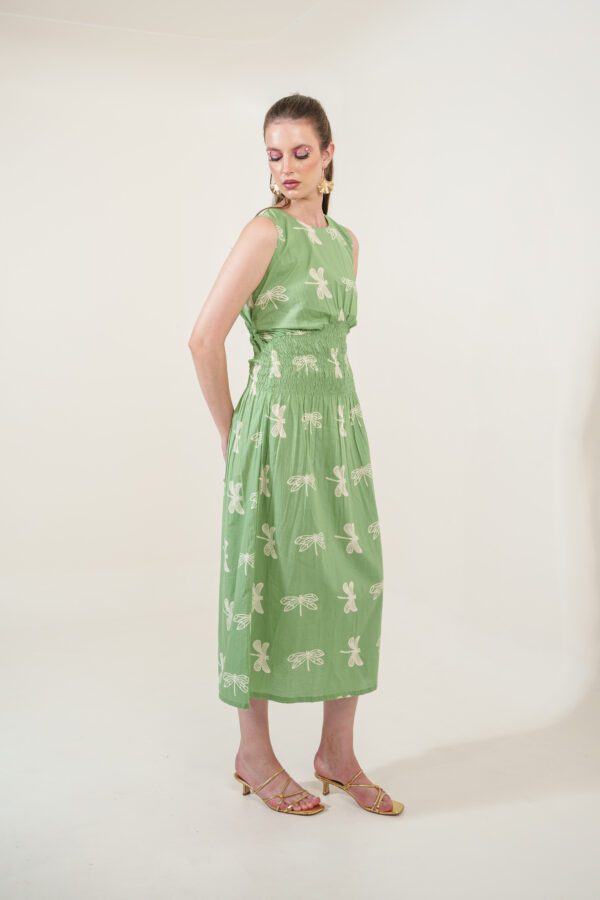 Firefly Dress leftside, with hands folded in the back