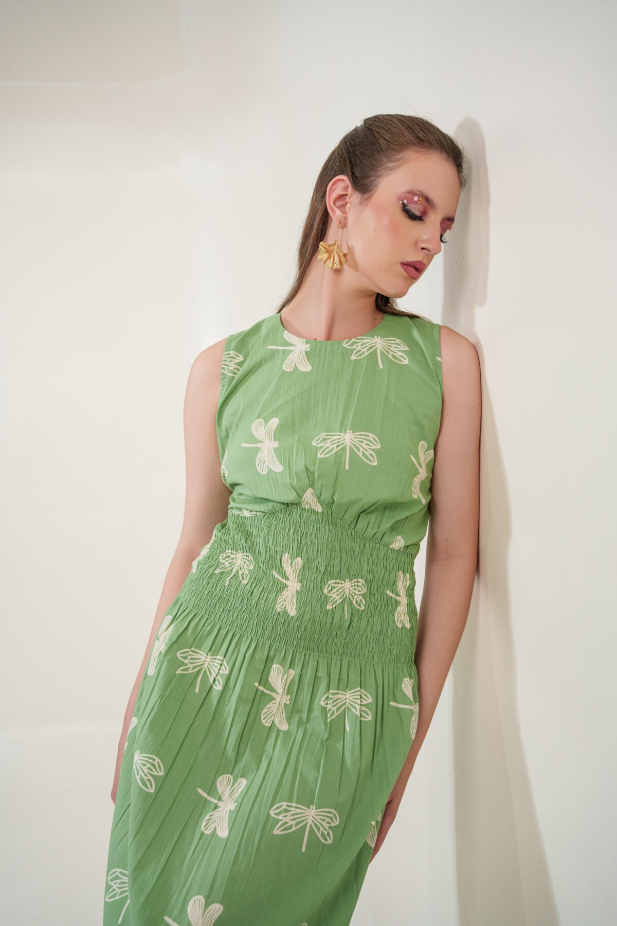 firefly dress model leaning on the right and looking right