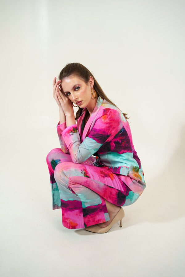 canvas set model squatting down with hands together near head