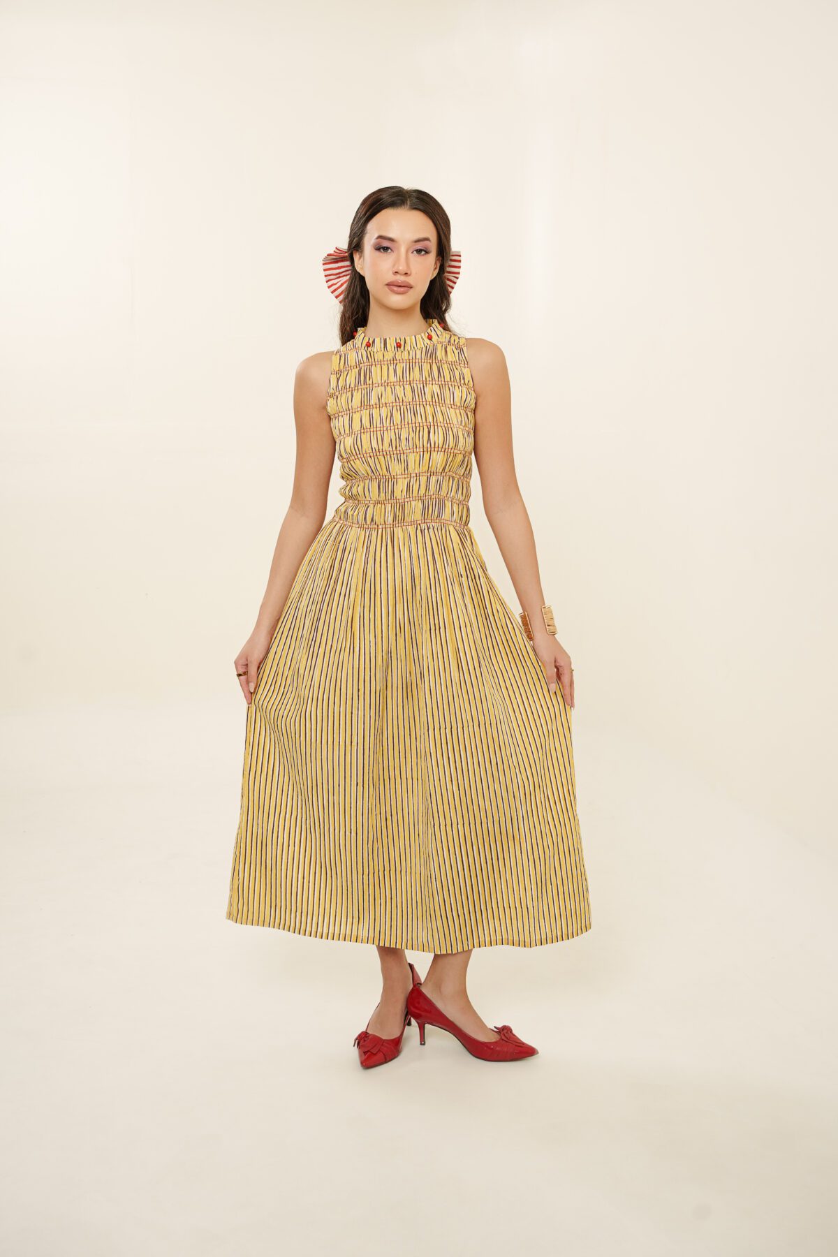 Taarini Dress model holding dress