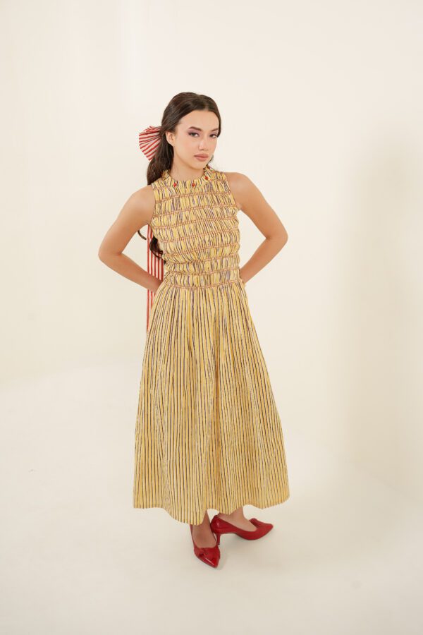Taarini Dress model with hands on the waist